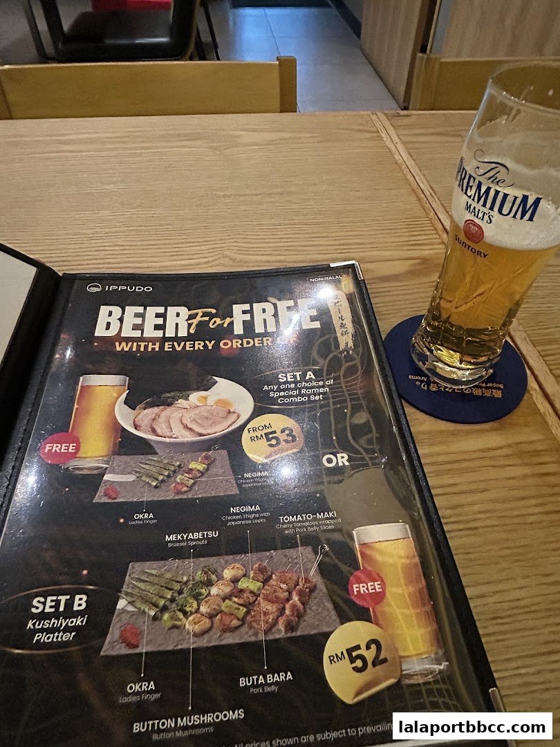 A menu from IPPUDO LaLaport BBCC featuring a beer promotion with ramen and kushiyaki sets.