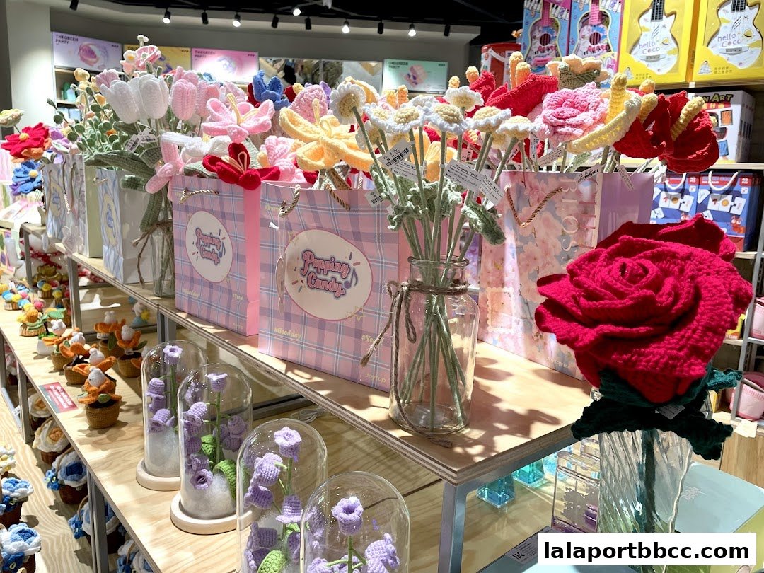 A display of handmade crochet flowers and decorative items in a retail shop.