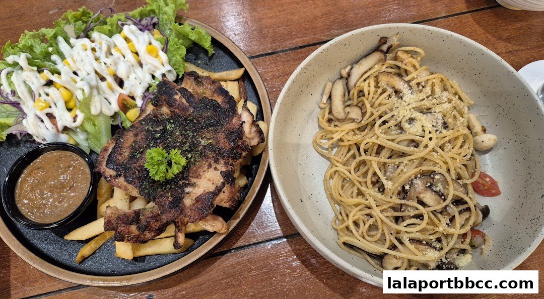 A grilled chicken steak with fries and salad, and a bowl of mushroom spaghetti.