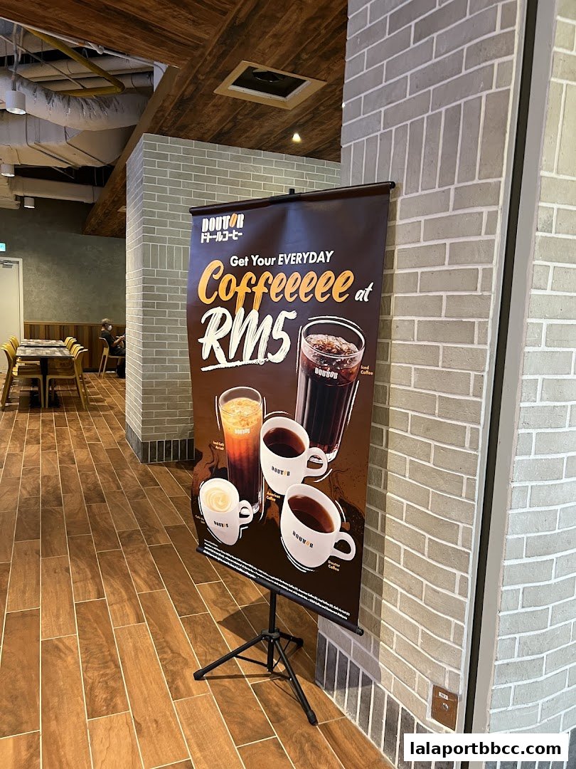A promotional banner for Doutor Coffee offering coffee at RM5.