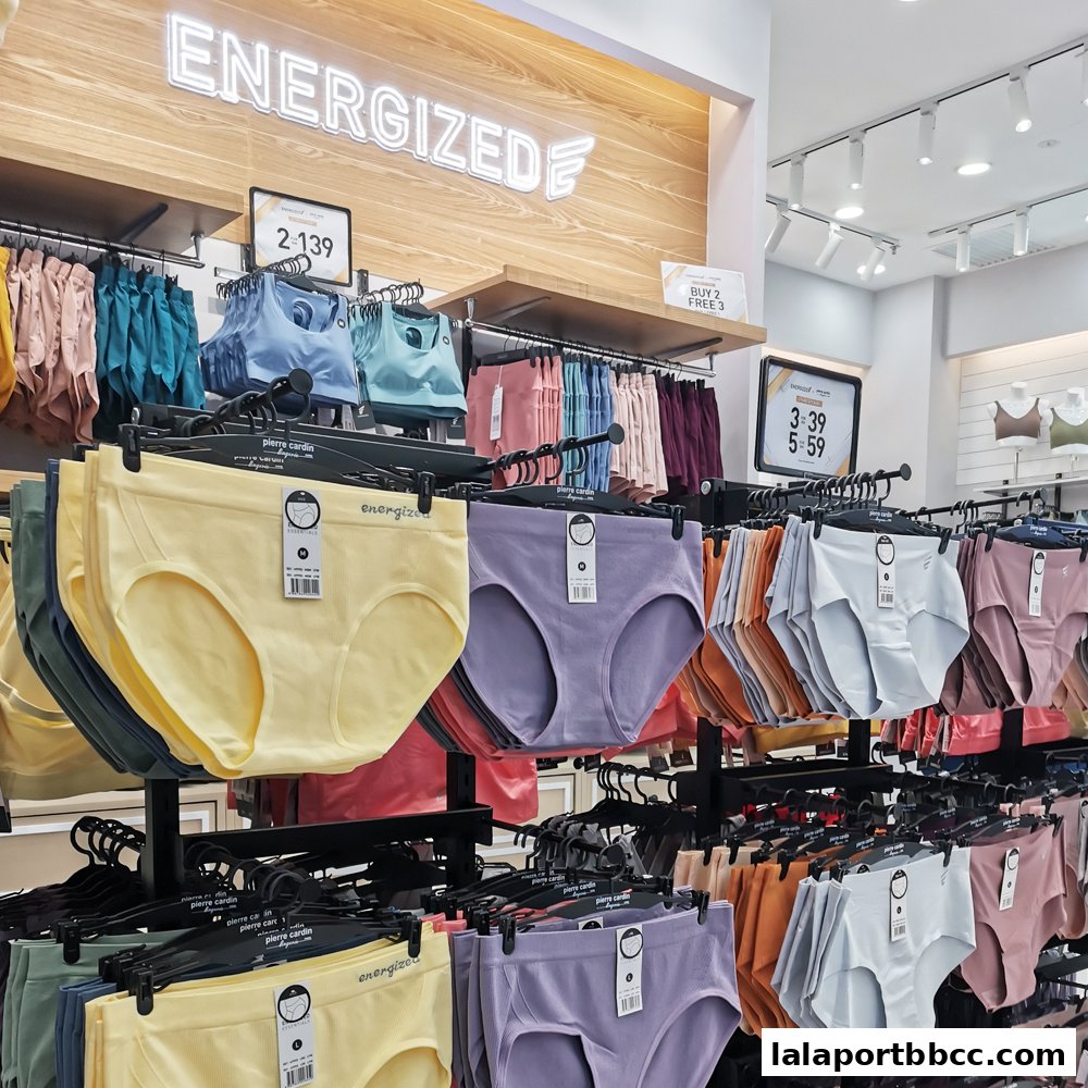 Interior view of a lingerie shop displaying colorful underwear and sports bras on racks.
