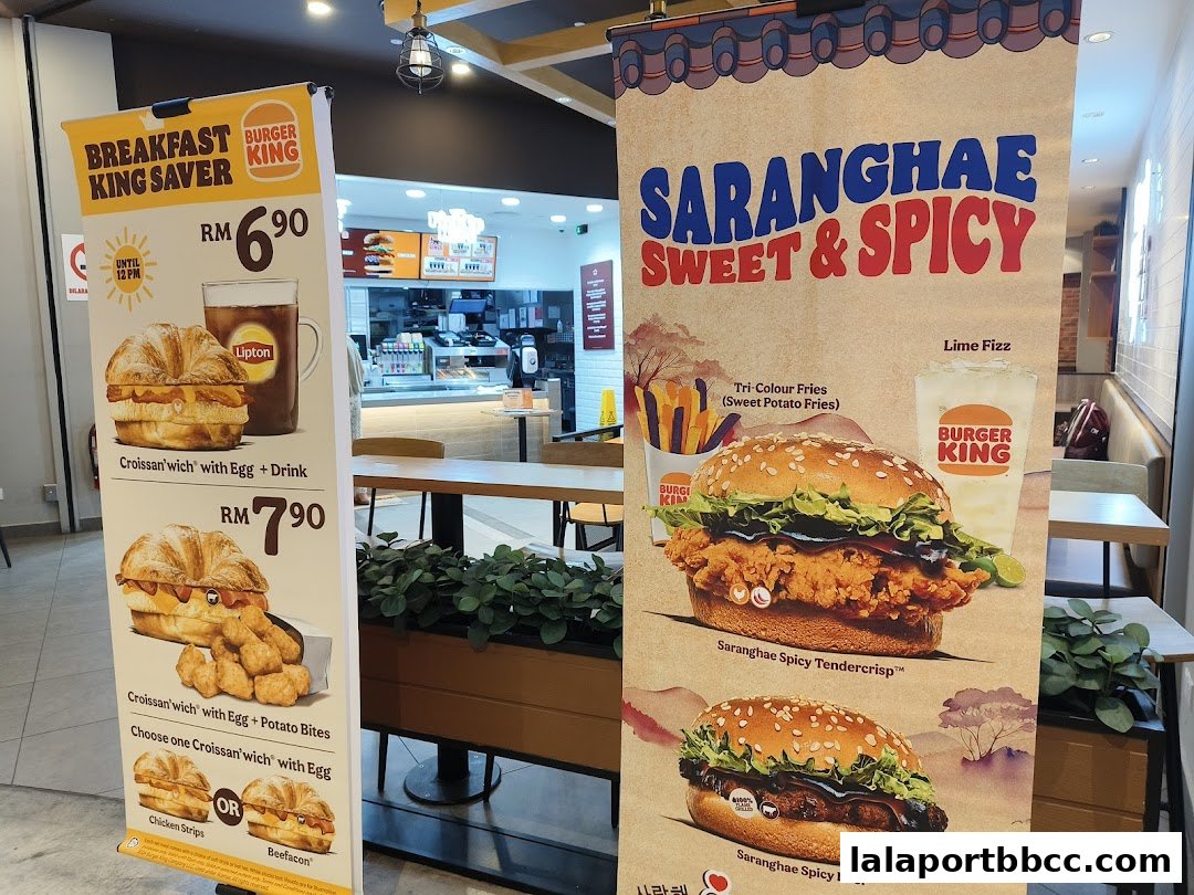 Burger King promotional banners showcasing breakfast savers and spicy burgers.