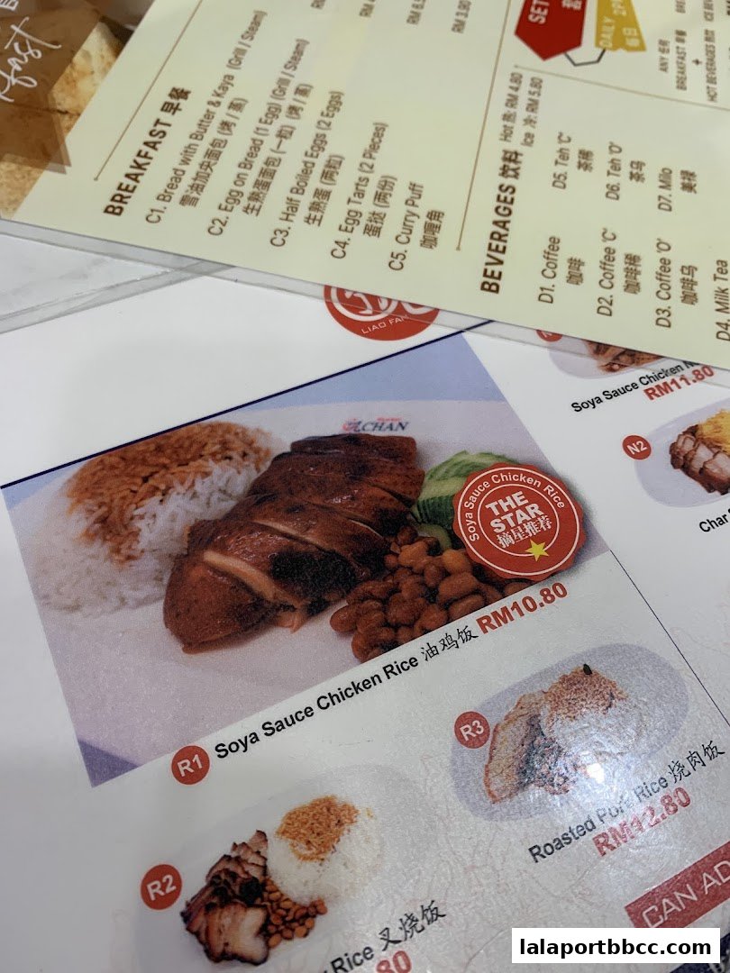 A menu from Hawker Chan LaLaport BBCC featuring Soya Sauce Chicken Rice and other dishes.