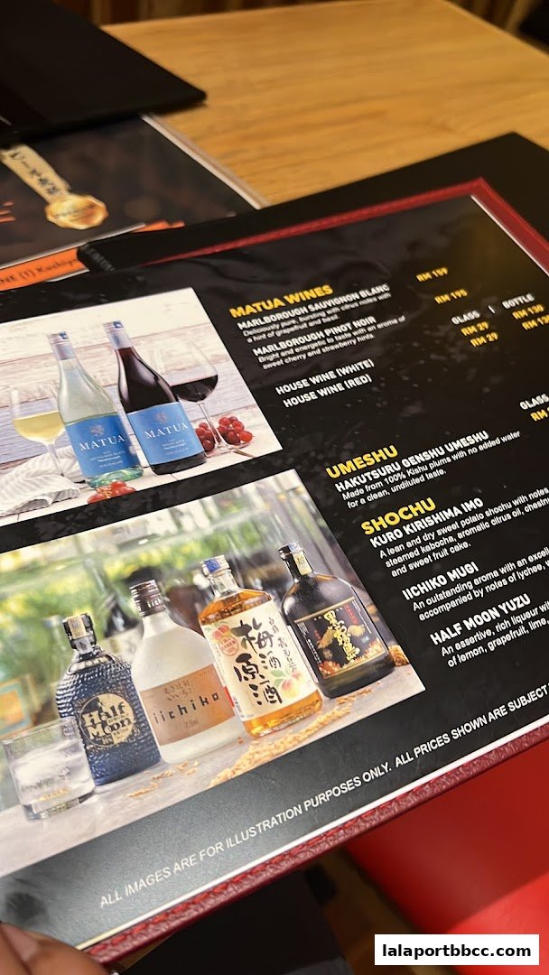 A menu featuring wines, umeshu, and shochu with accompanying bottle and glass prices.