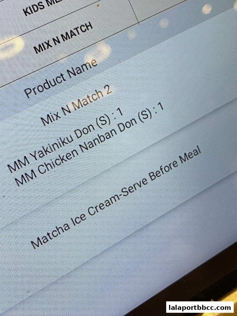 A close-up of a digital menu showing sushi and dessert options.