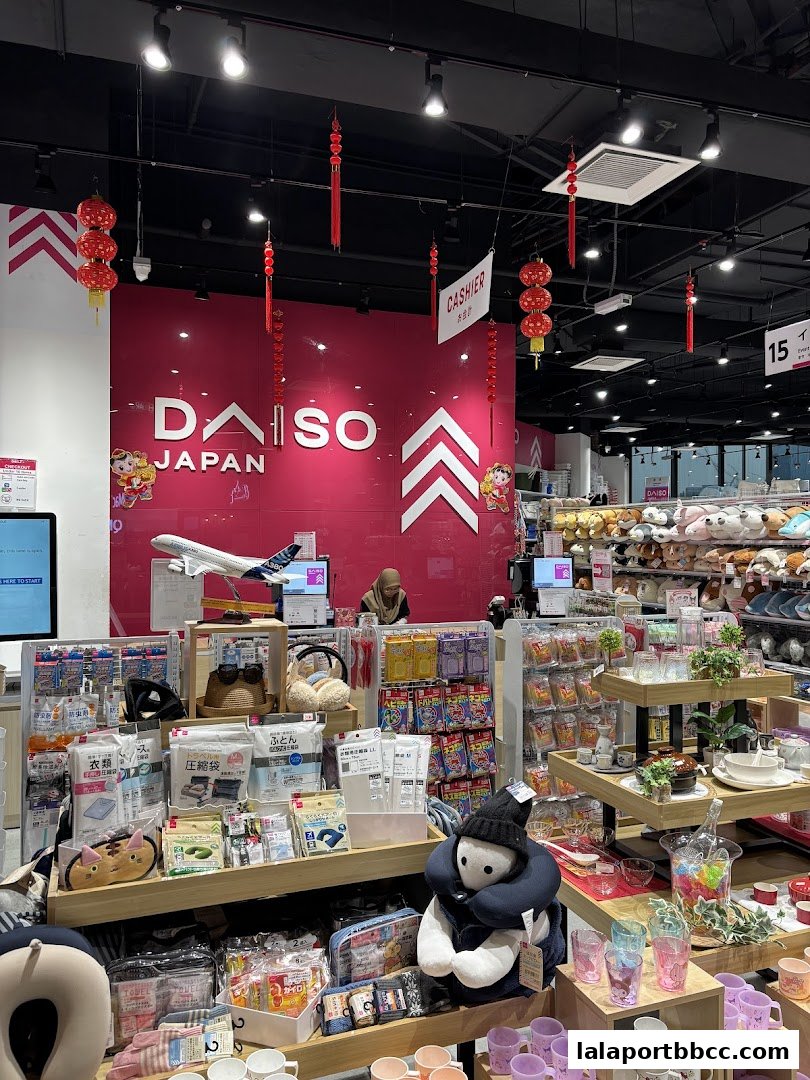 Interior view of a DAISO Japan store showcasing various products and a cashier counter.