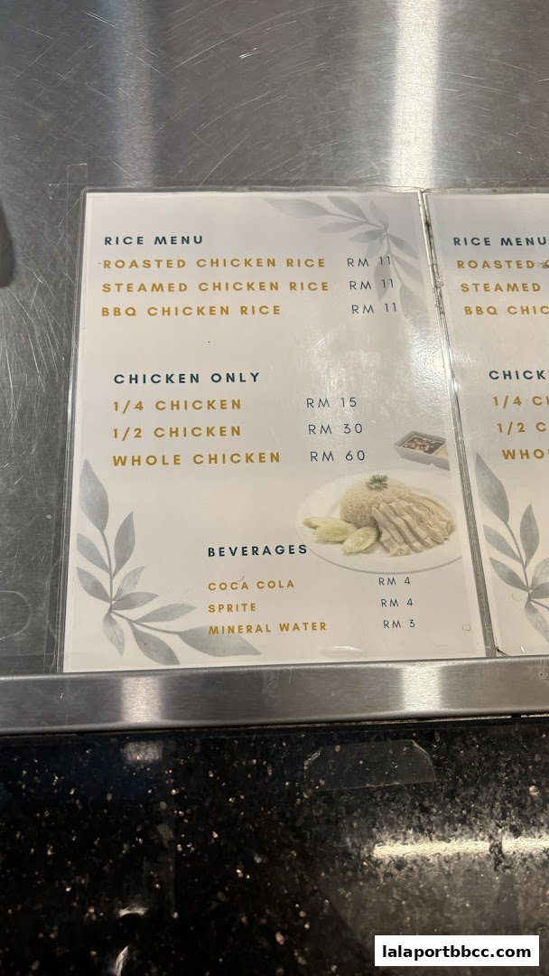 A menu from Johnny Chicken Rice LaLaport featuring rice dishes, chicken portions, and beverages.