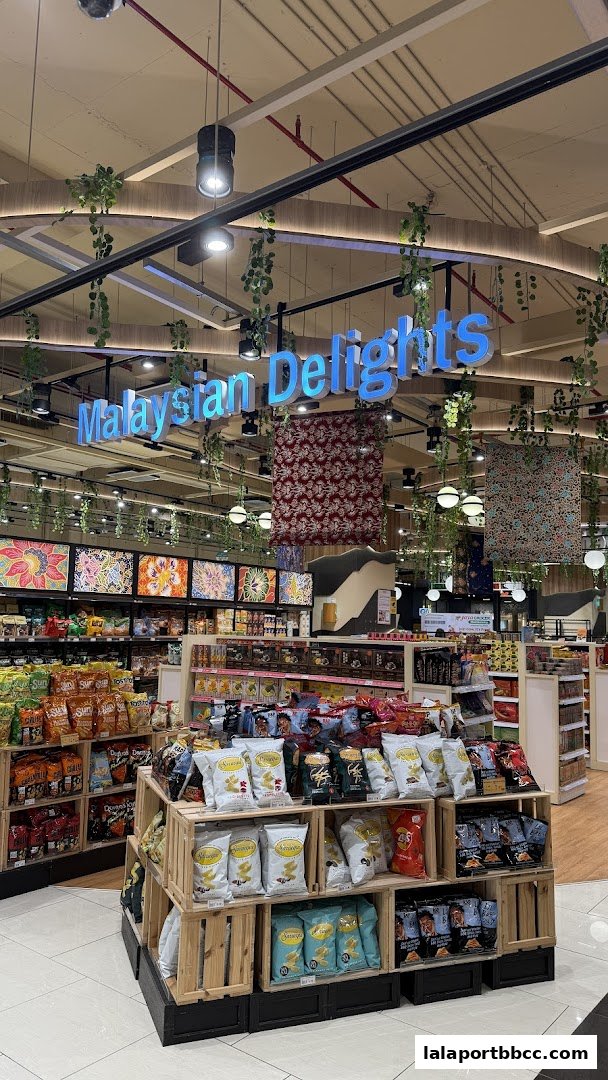 A display of snacks and Malaysian delights in a grocery store with decorative elements.