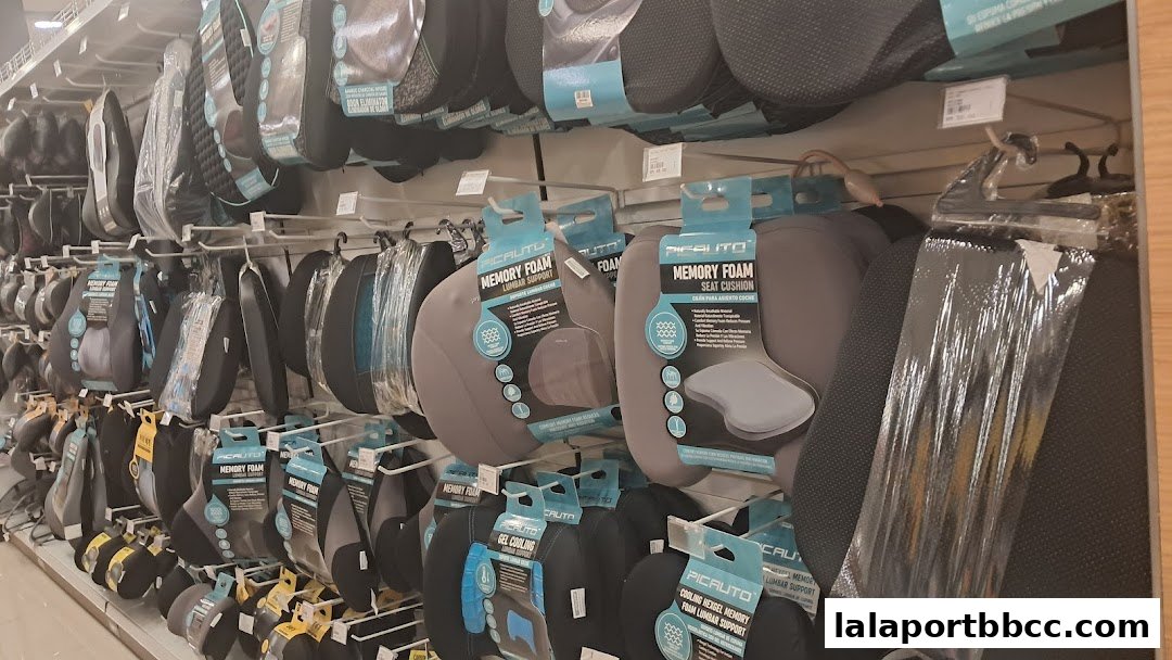 Shelves stocked with various memory foam seat and lumbar support cushions.