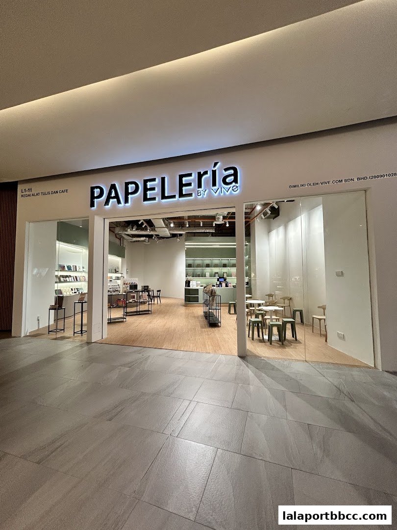 The entrance of Papeleria by VIVE, a stationery and cafe shop, with interior visible.