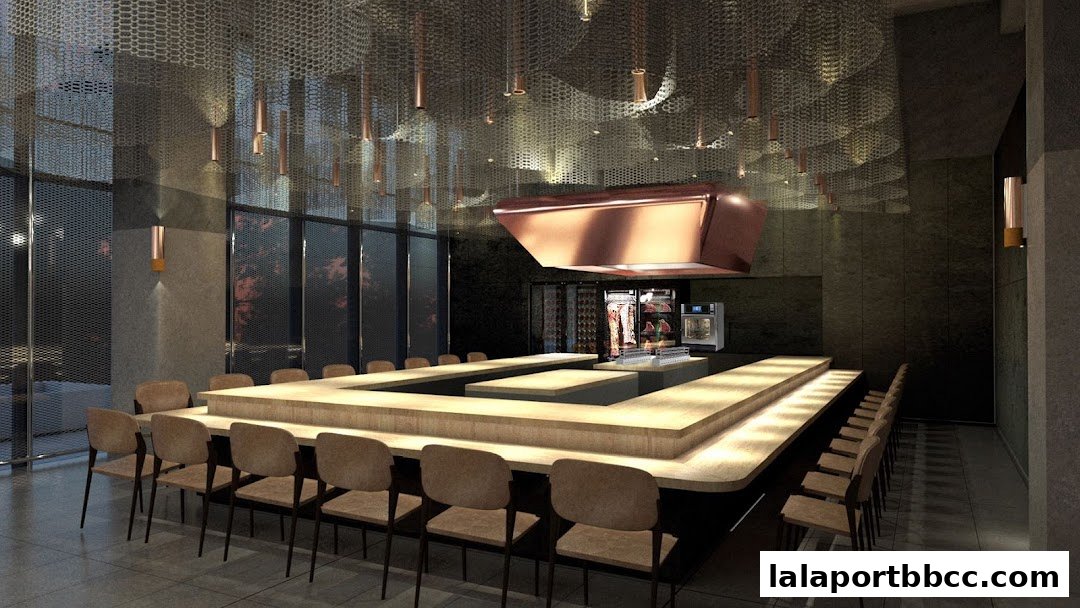 Interior of a modern restaurant with a long counter seating and a copper hood.