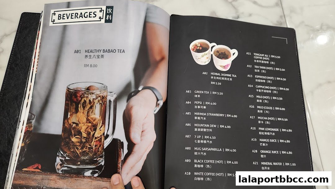 A menu featuring a variety of beverages, including teas, coffees, and juices, with prices listed.