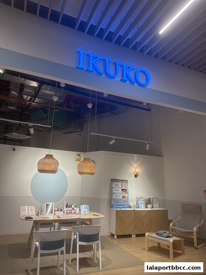 Interior of IKUKO JAPAN BEAUTY shop with a reception desk, seating, and product displays.