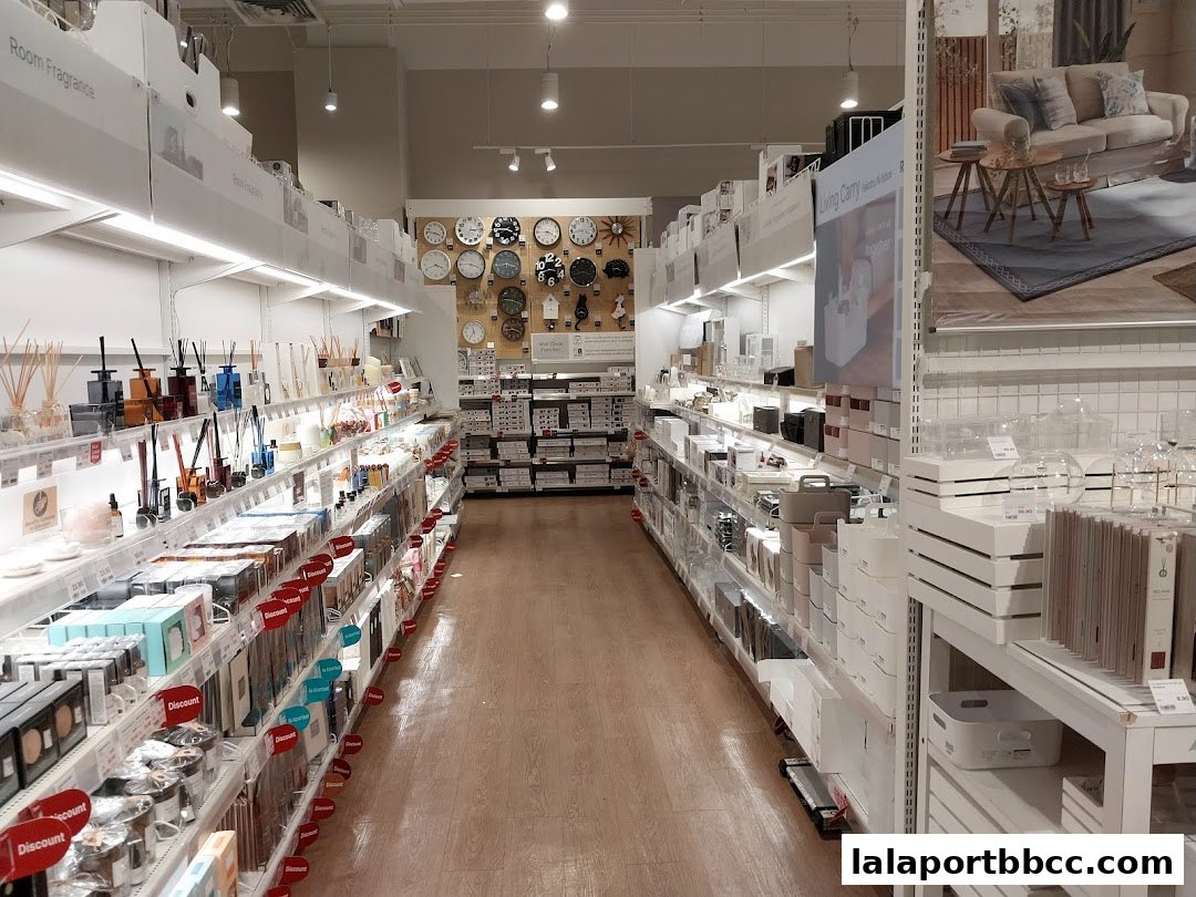 Interior view of a NITORI store showcasing home goods and decor items on shelves.