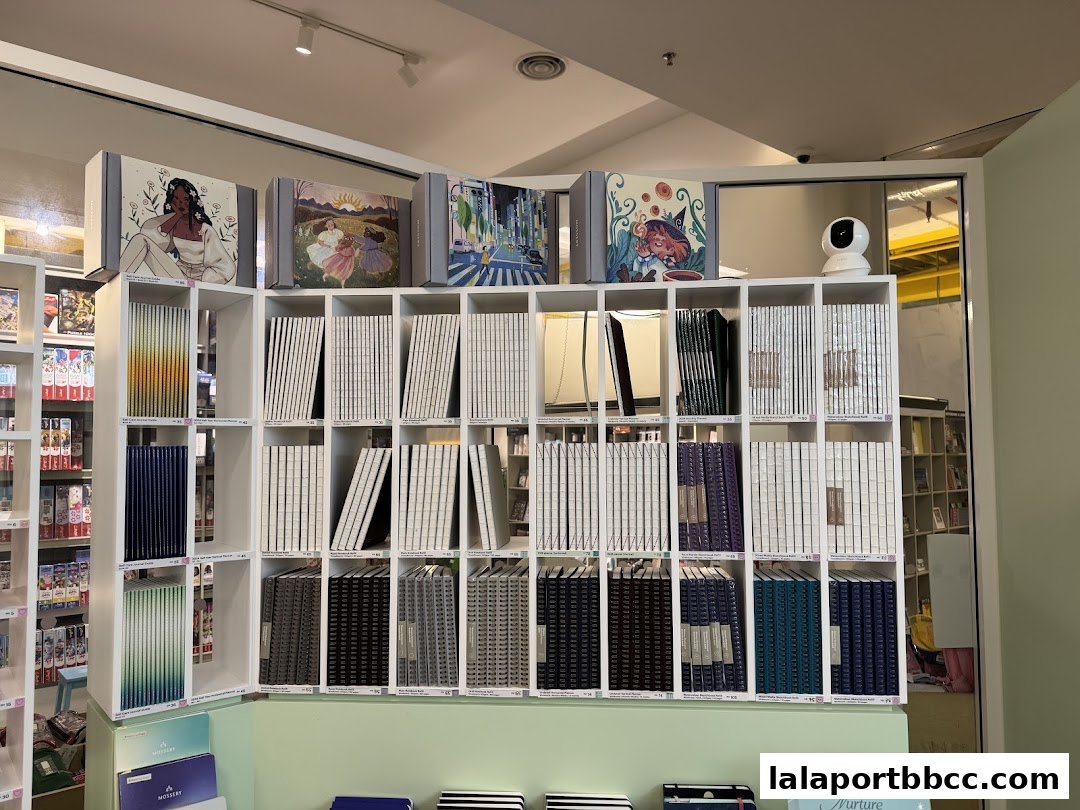 A retail shop interior displaying a wide selection of notebooks and planners on shelves.