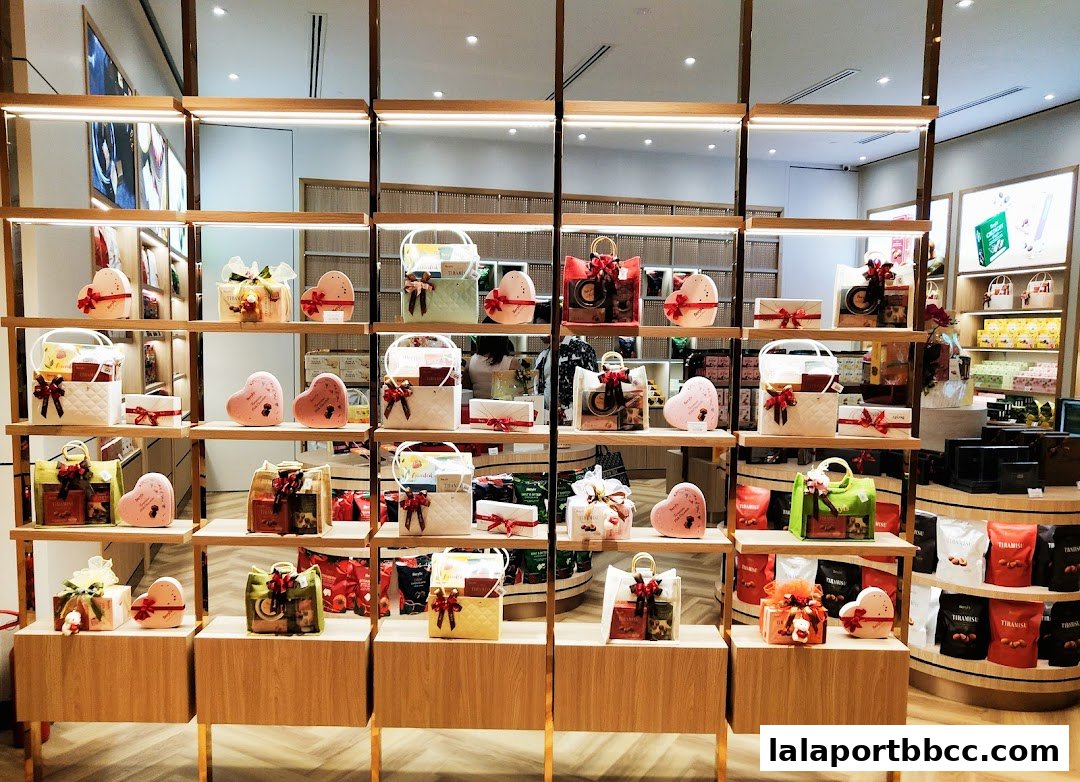 A beautifully arranged display of assorted chocolates and gift boxes in a retail store.