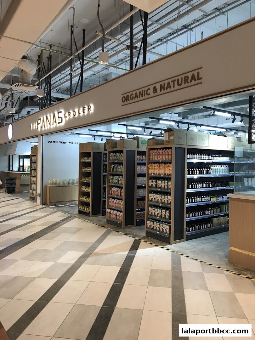 Interior view of a grocery store with shelves stocked with organic and natural products.