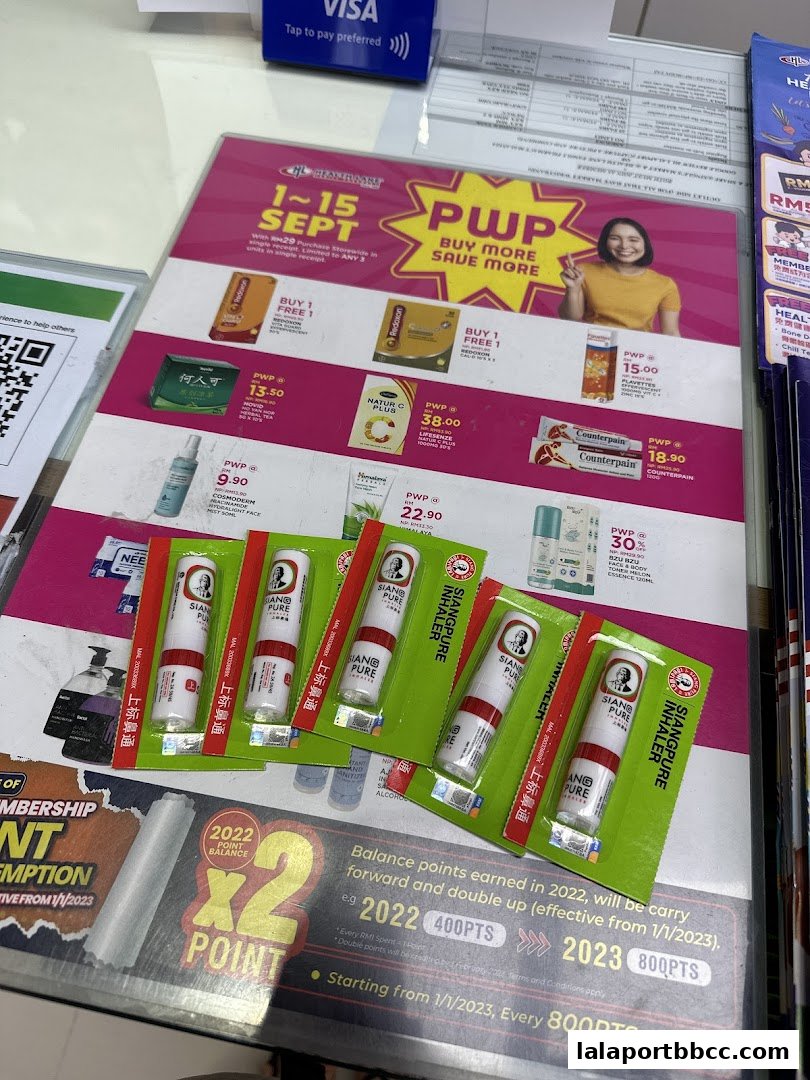 Promotional flyers and products from Health Lane Family Pharmacy, featuring inhalers and health supplements.