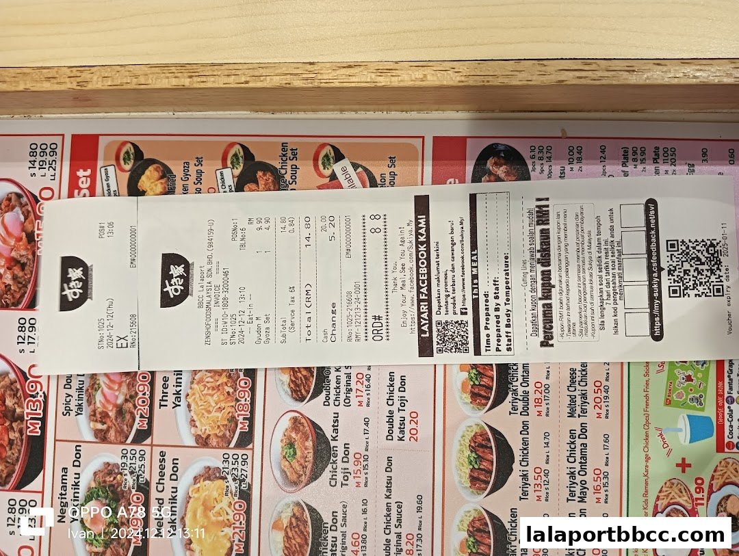 A receipt and menu from Sukiya Tokyo Bowls & Noodles, showcasing various donburi and side dishes.
