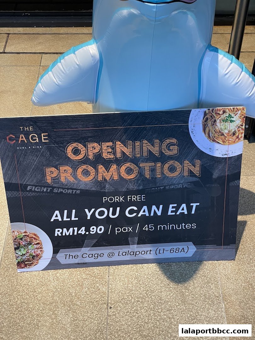 A sign for The Cage's opening promotion offering pork-free all-you-can-eat for RM14.90.