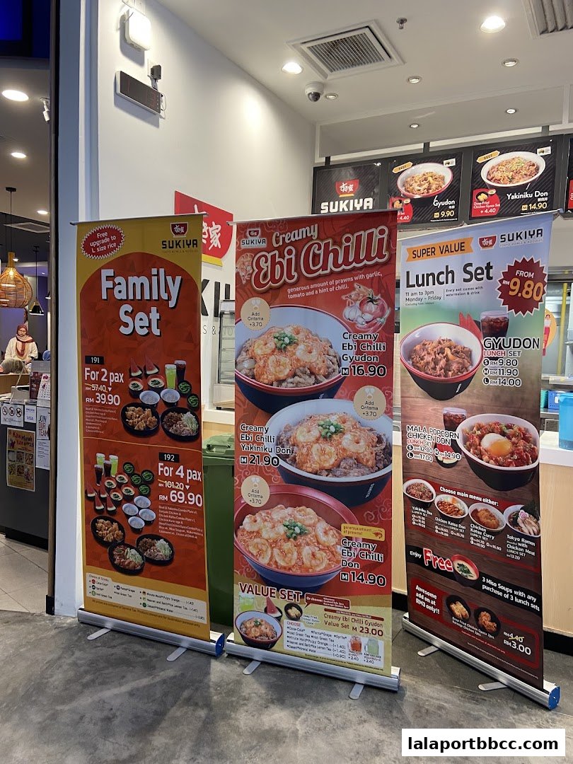 Three promotional banners for Sukiya restaurant, showcasing family sets, creamy ebi chilli dishes, and lunch sets.