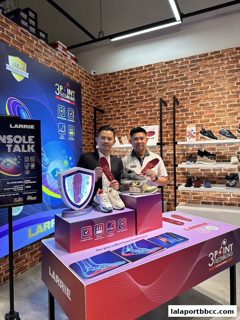 Two men present Larrie insoles and shoes, highlighting comfort and foot pain relief.