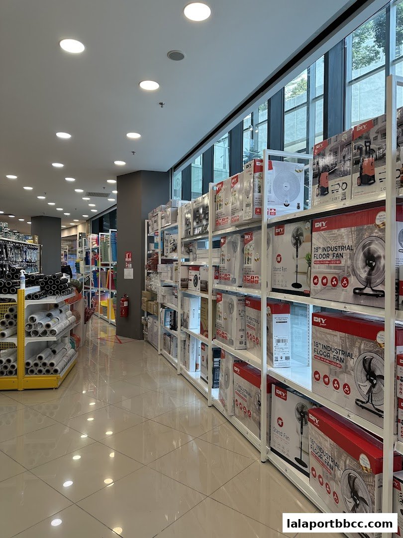 Interior view of MR.DIY PLUS store showcasing shelves stocked with fans and home improvement supplies.