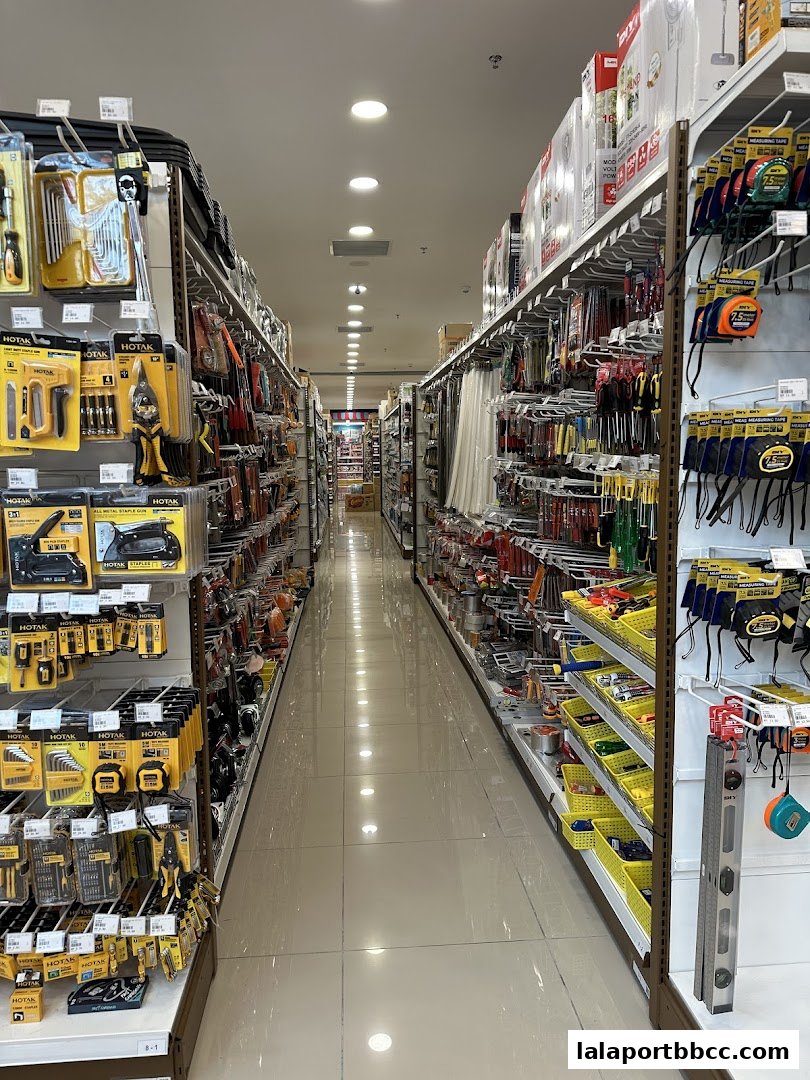Aisle view of a MR.DIY PLUS store showcasing a wide variety of tools and hardware supplies.