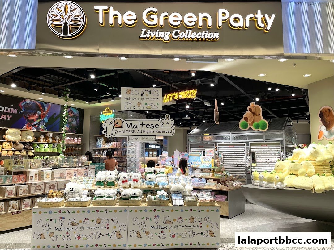 The Green Party shop interior featuring plush toys, merchandise, and colorful displays.