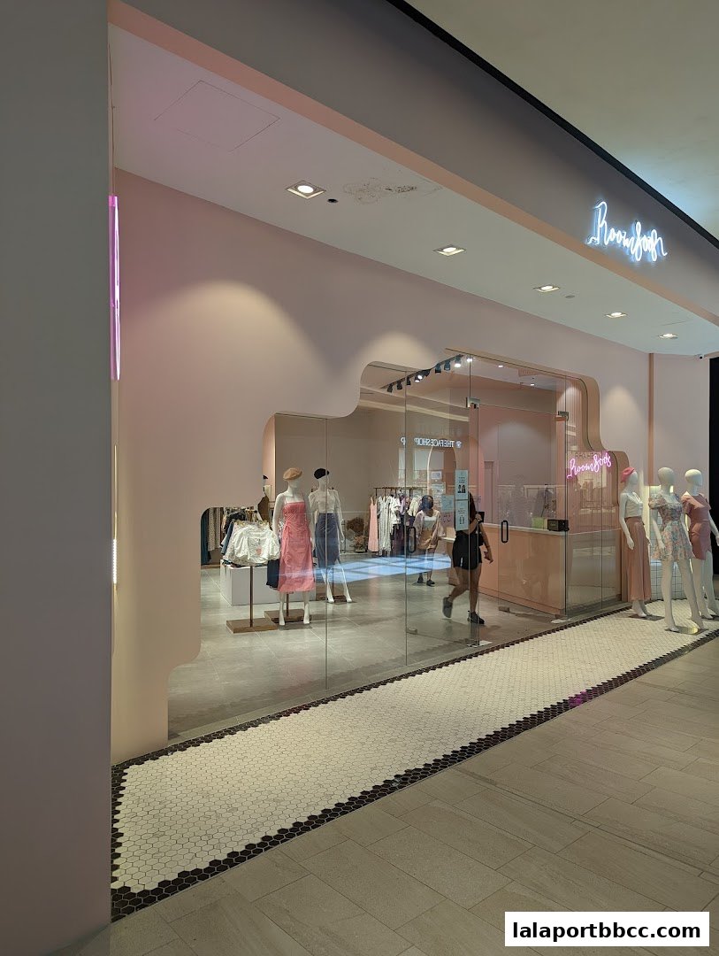 The entrance of Room 8008 LaLaport, showcasing mannequins and clothing displays.