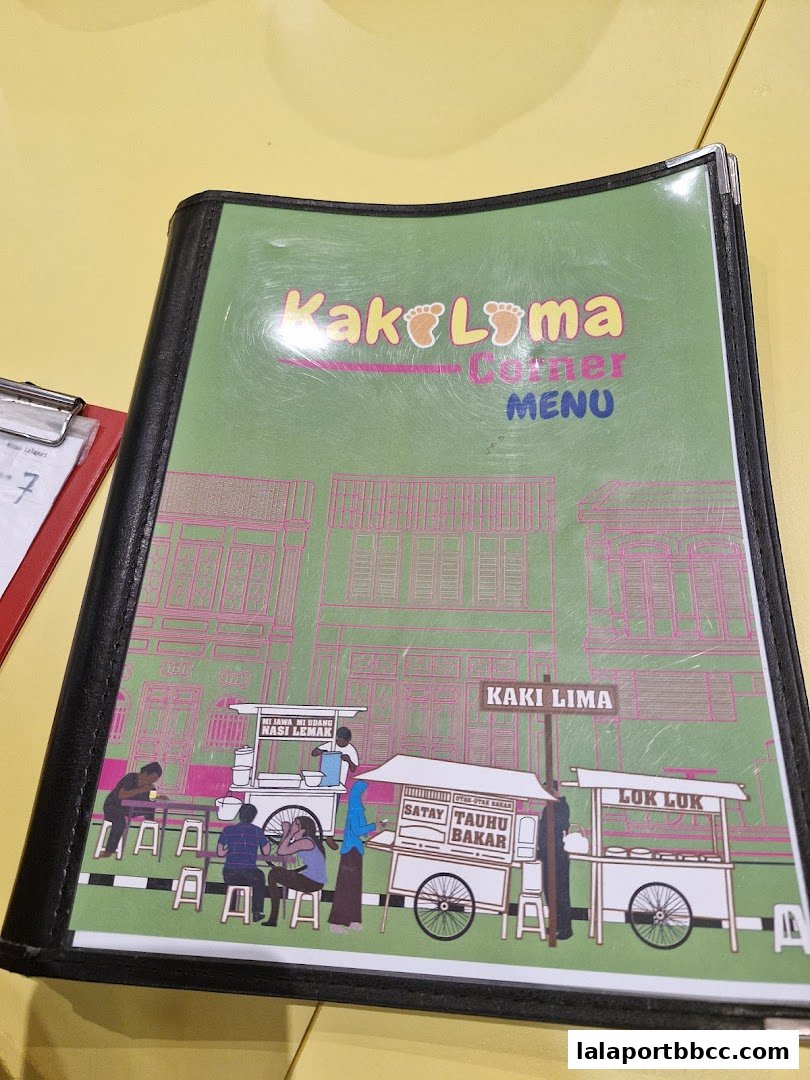 A menu from Kaki Lima Corner featuring street food stalls and dishes.