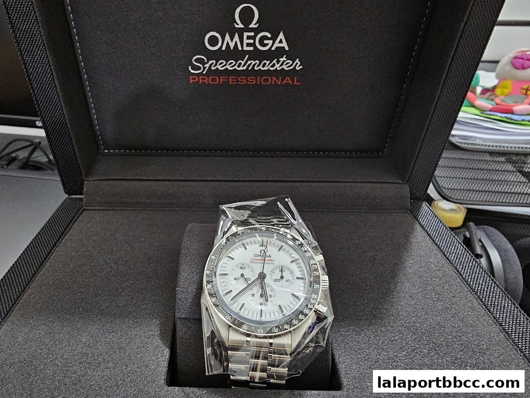 An Omega Speedmaster Professional watch presented in its official branded box.