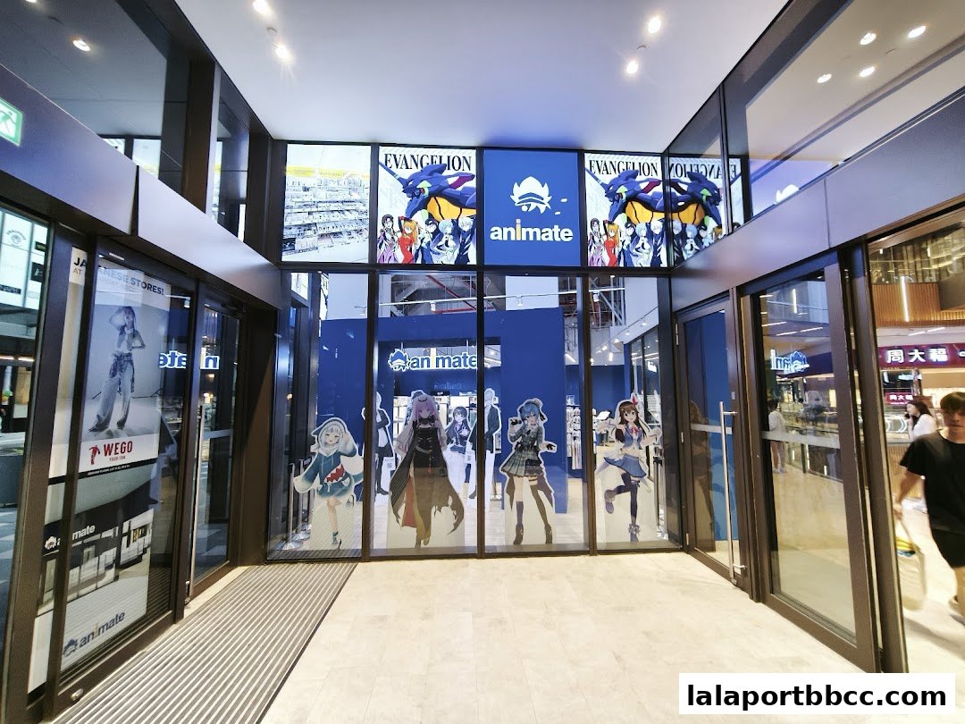 The entrance to Animate Lalaport BBCC, featuring anime characters and Evangelion posters.
