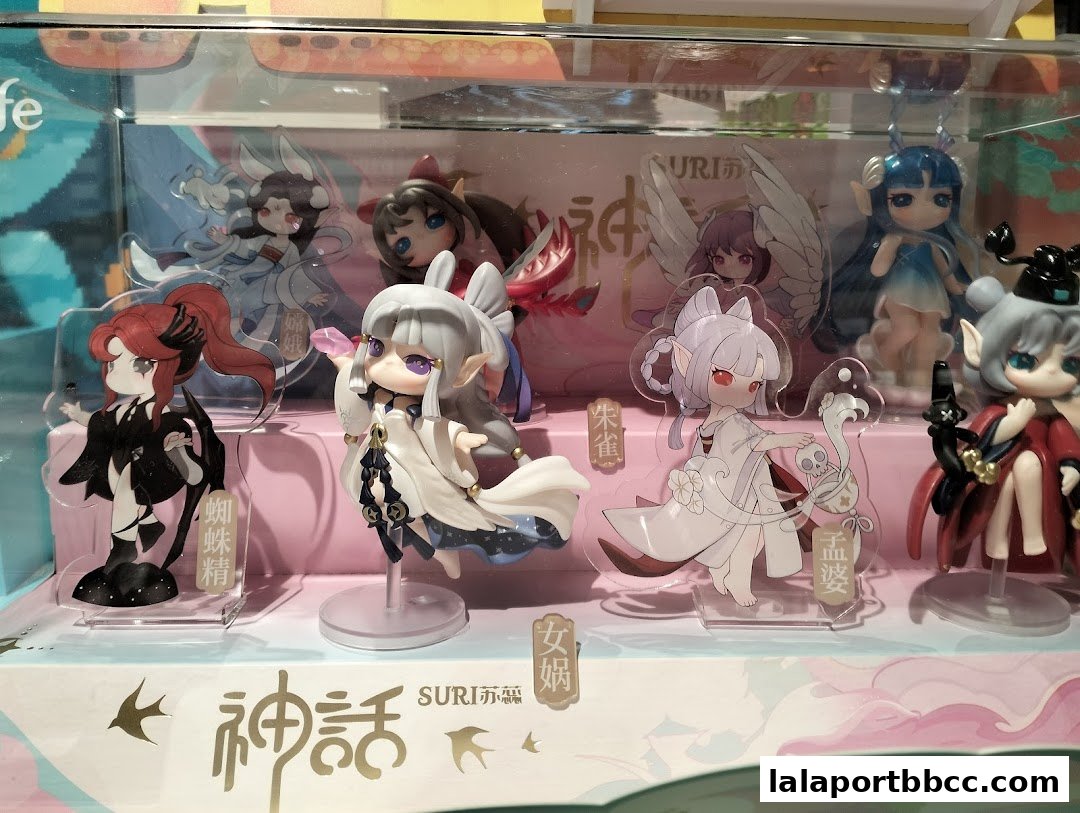 A display of various anime-style figurines with intricate details and colorful outfits.