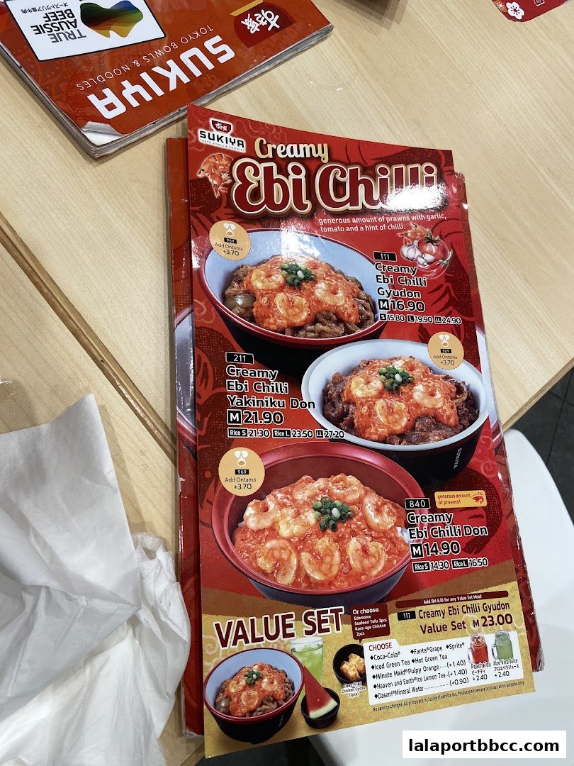 A menu from Sukiya featuring their Creamy Ebi Chilli dishes, including Gyudon and Yakiniku Don.