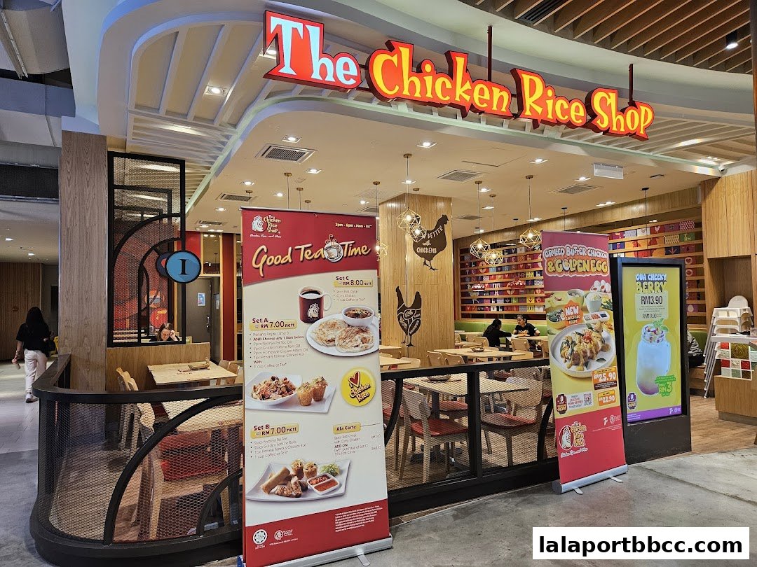 The Chicken Rice Shop storefront with promotional banners and indoor seating visible.