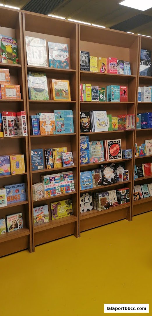 A wide shot of bookshelves filled with children's books and educational materials.