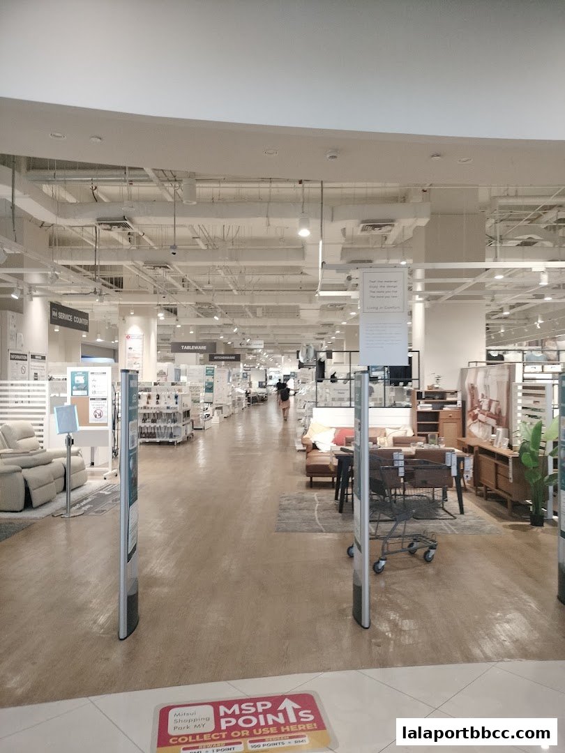 Interior view of a NITORI store with furniture and home goods displays.