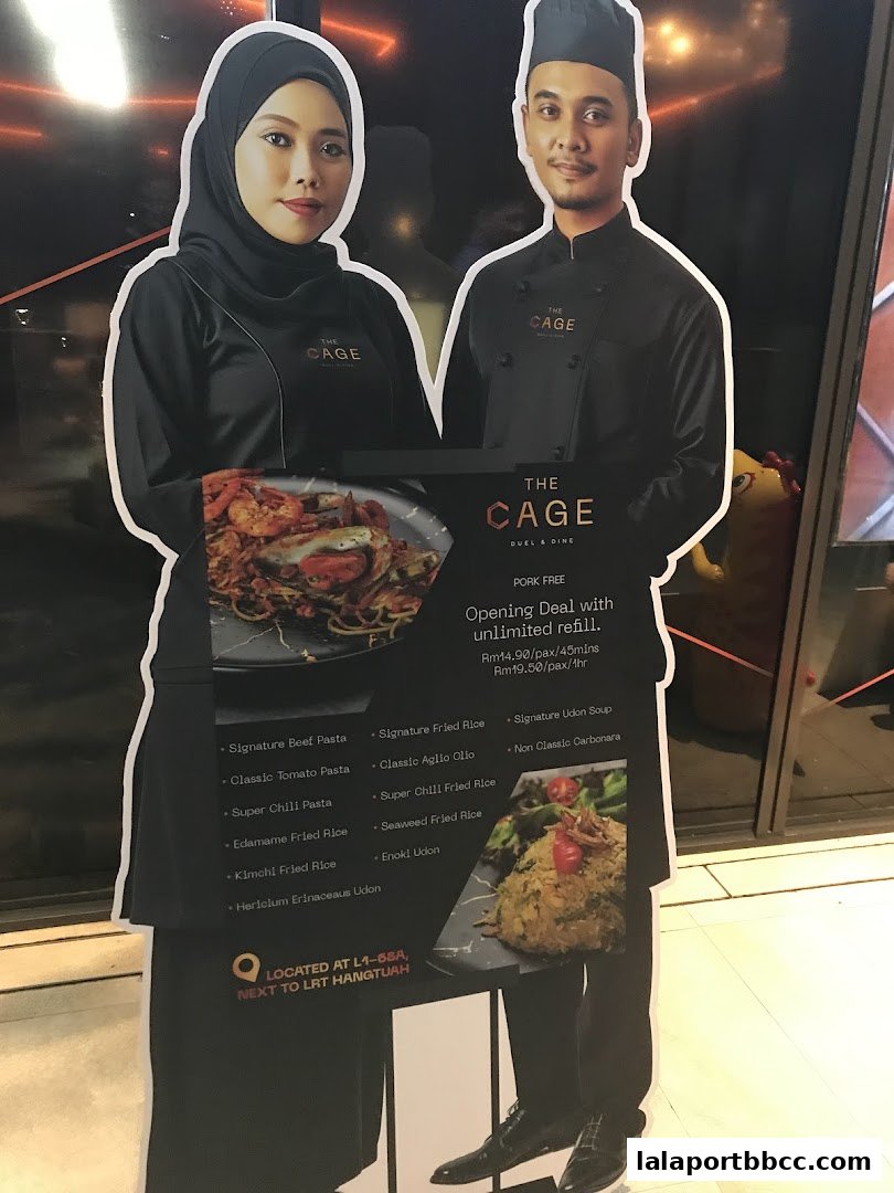 Cardboard cutouts of a male and female server advertising a restaurant's opening deal.