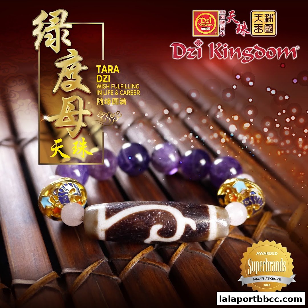 A close-up of a Dzi bead bracelet with amethyst and gold accents, promoting wish fulfillment.
