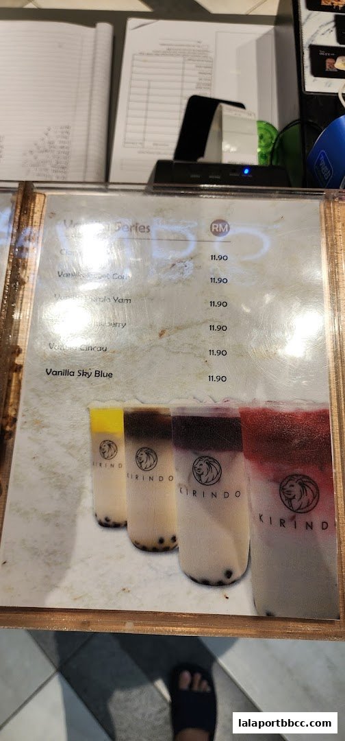 A menu from Kirindo featuring various drinks with prices and images of colorful beverages.