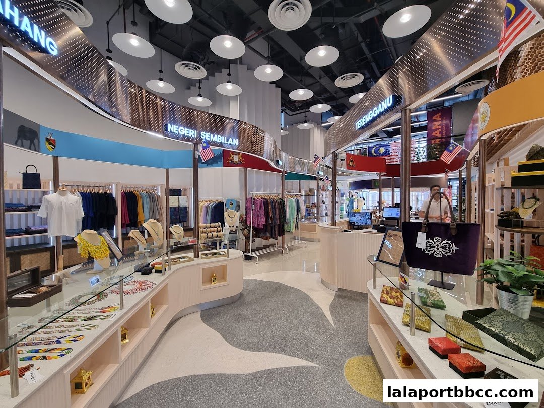 Interior view of a retail shop showcasing traditional Malaysian clothing and accessories.