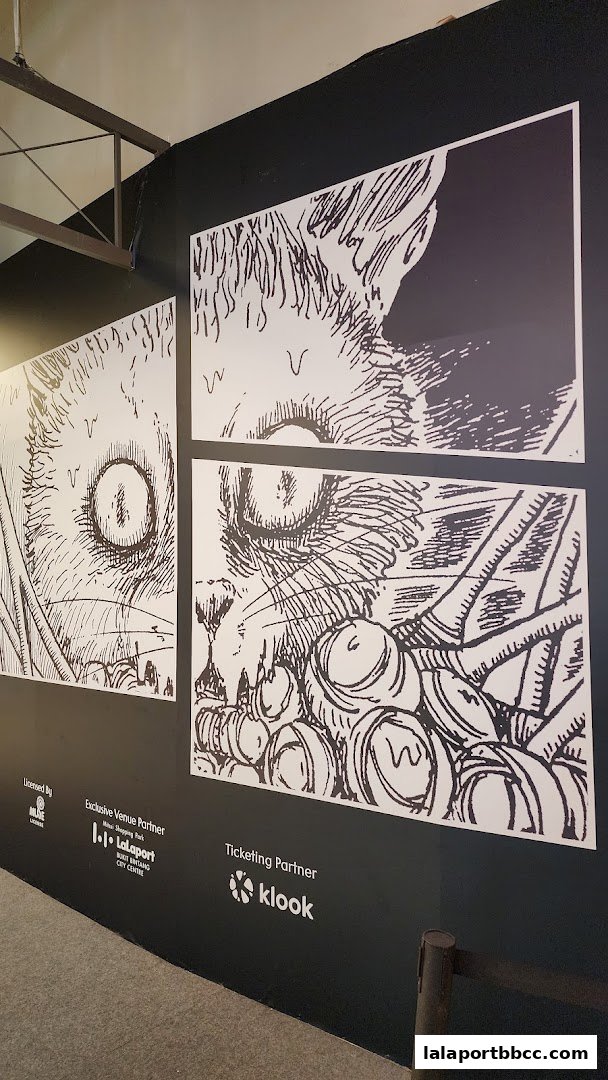 Junji Ito Horror House Lalaport features striking black and white artwork of a cat's eye and barrels.