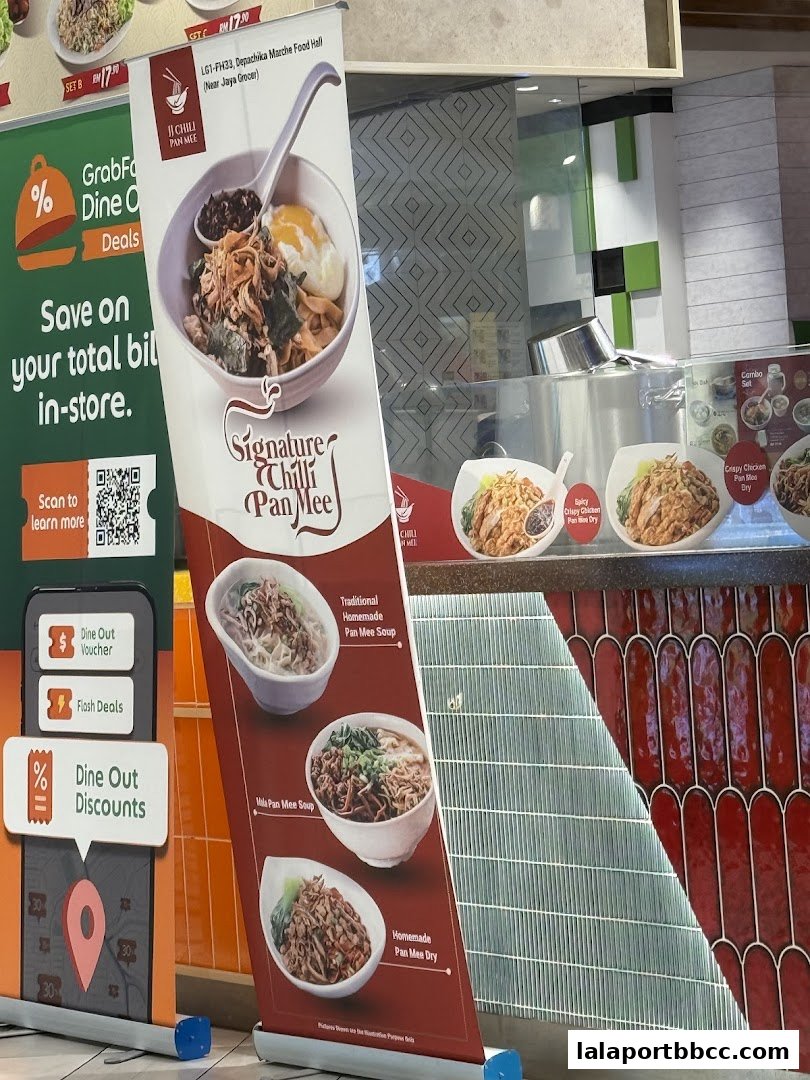 A promotional banner for JJ Chili Pan Mee showcasing their signature dishes and discounts.