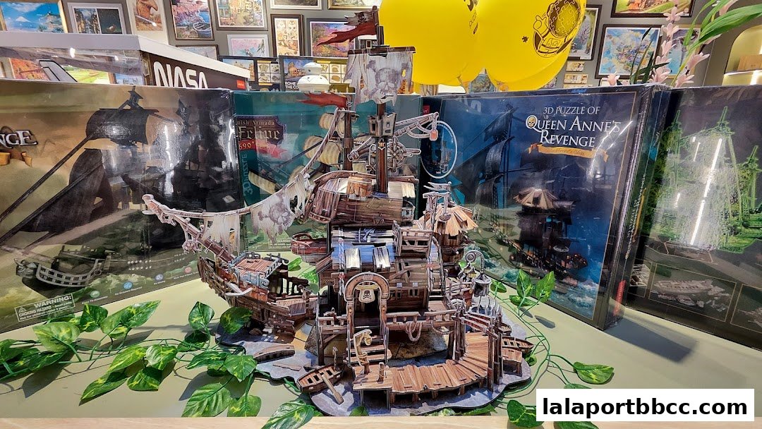 A detailed 3D puzzle of a pirate ship is displayed with puzzle boxes and balloons.