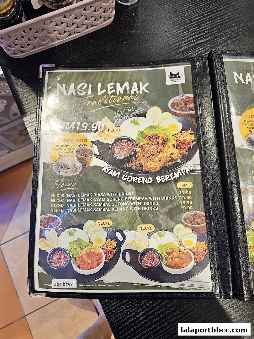A menu featuring Nasi Lemak dishes with various protein options and drinks.
