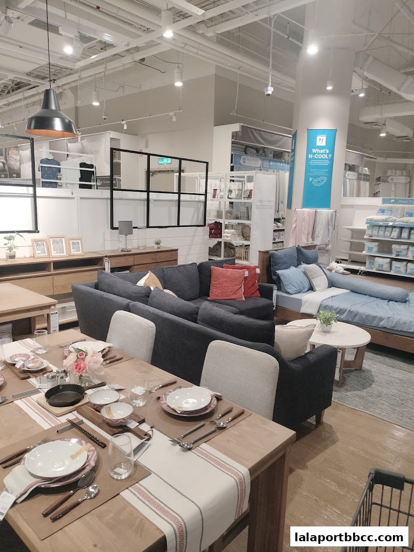 Interior view of a NITORI store showcasing furniture and home decor items.