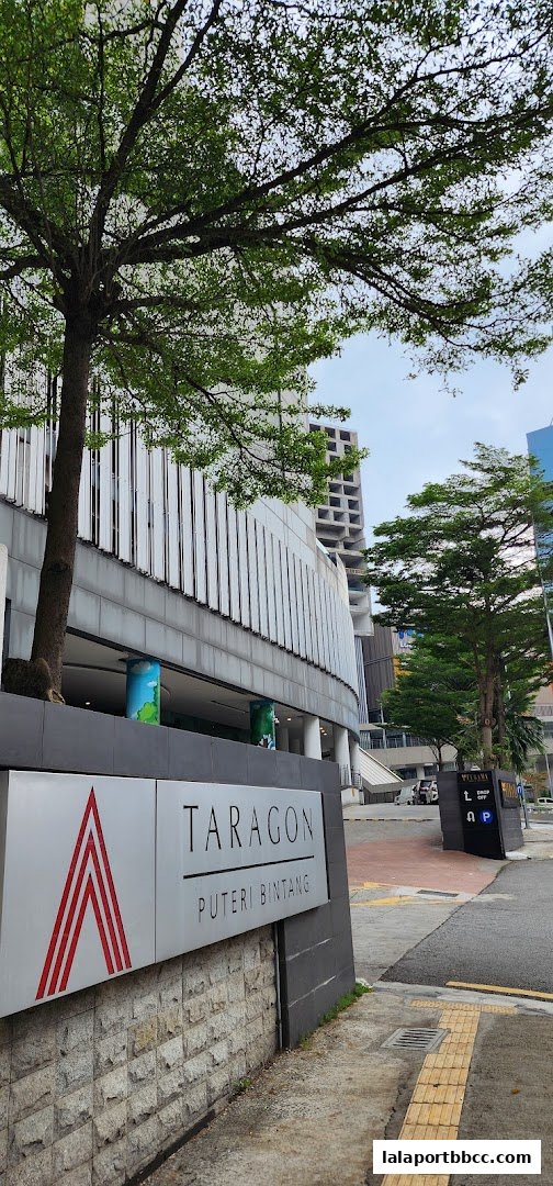 Exterior view of Taragon Puteri Bintang with trees and modern architecture.