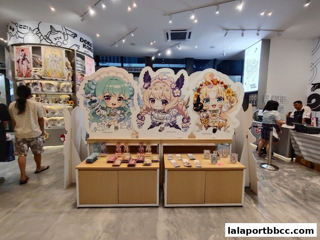 Interior of Doko Koko shop featuring anime-style character displays and merchandise.