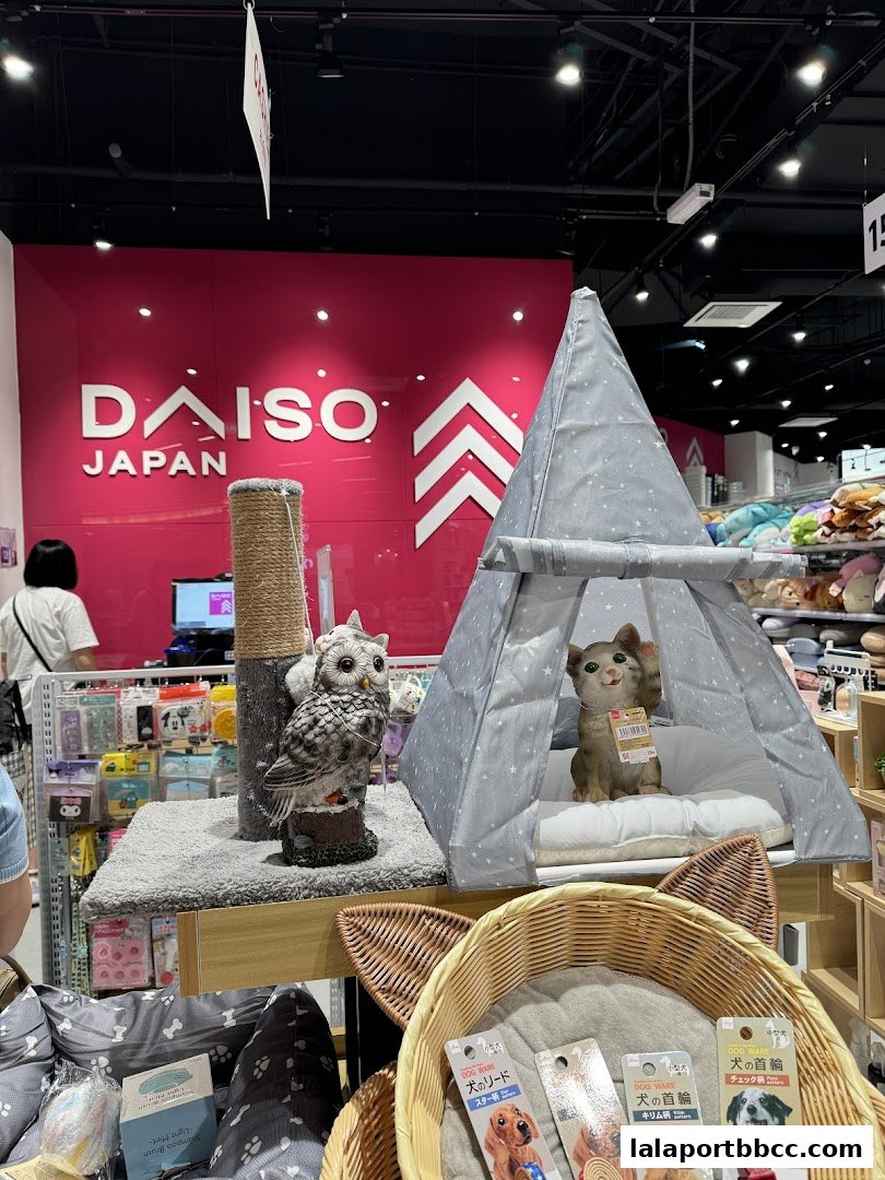 Interior shot of a Daiso Japan store featuring pet accessories and home decor.